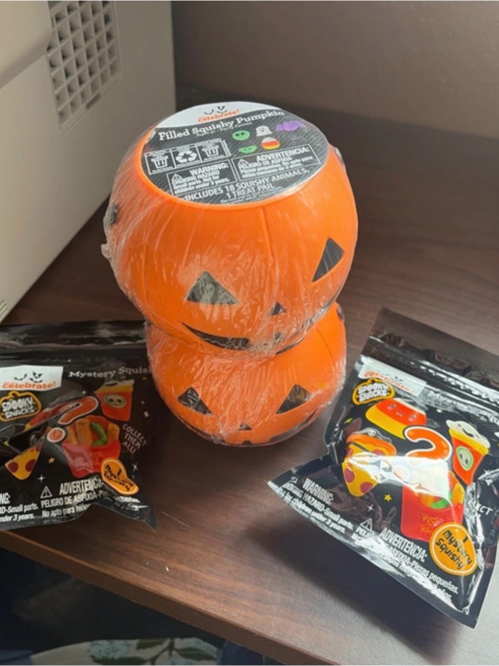 2 squishy filled buckets and 2 Halloween squishy toys